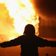 A demonstrator stands as a business burns after it was set on fire during rioting following the grand jury announcement in the Michael Brown case Nov. 24, 2014, in Ferguson, Mo.
Scott Olson/Getty Images